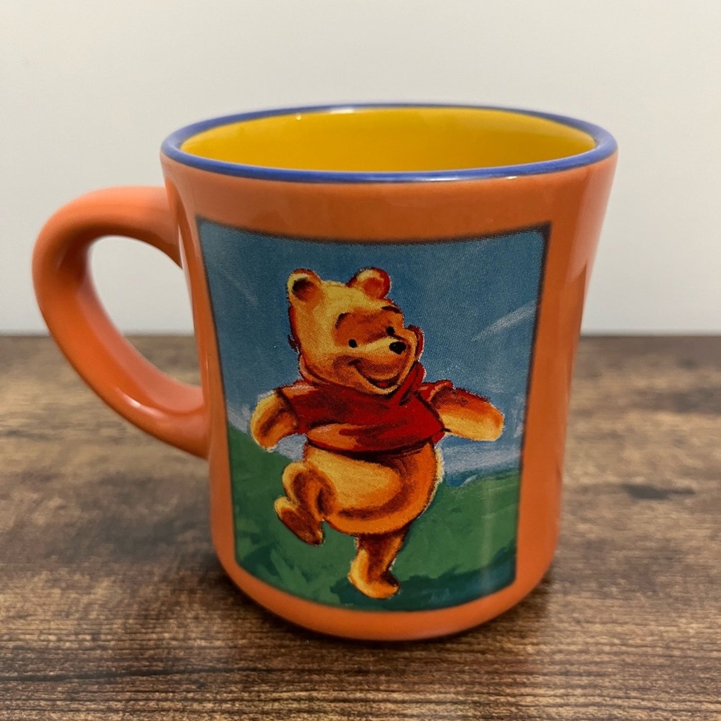 Winnie the Pooh Disney Store coffee mug Peach Yellow Blue glaze