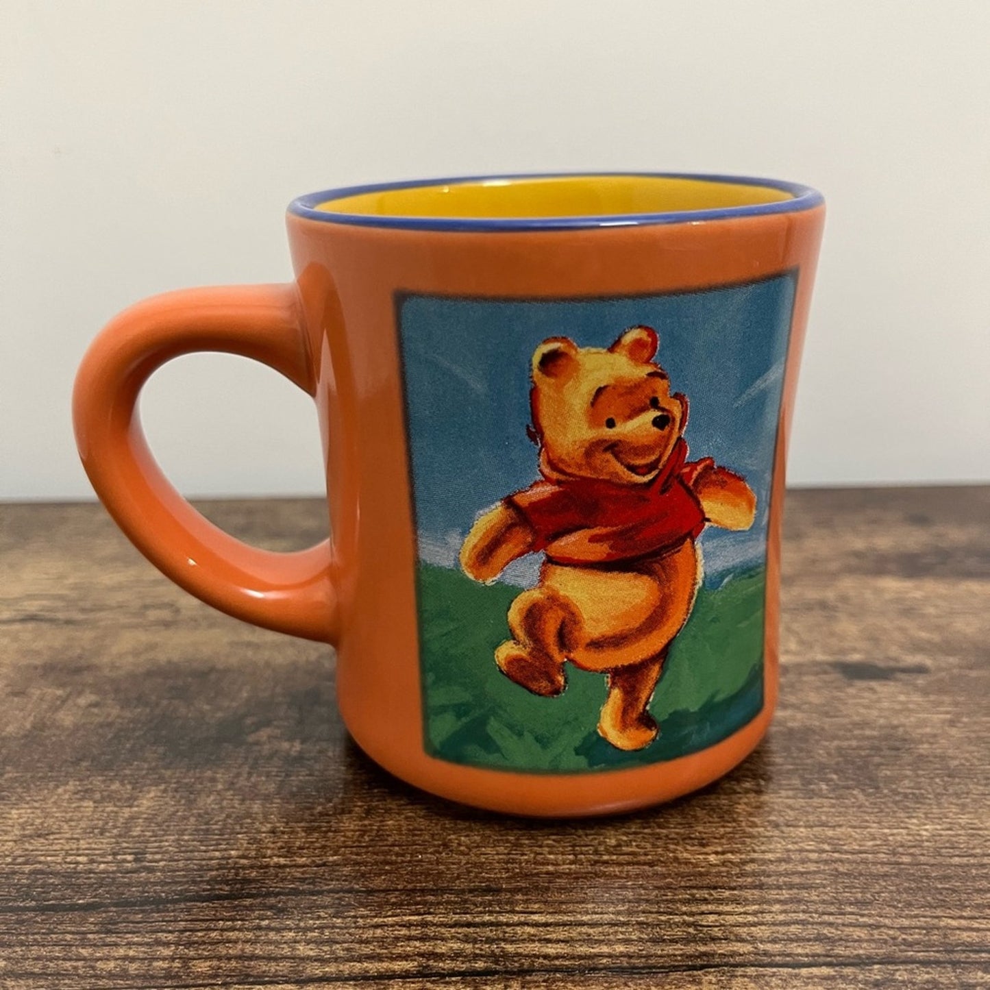Winnie the Pooh Disney Store coffee mug Peach Yellow Blue glaze